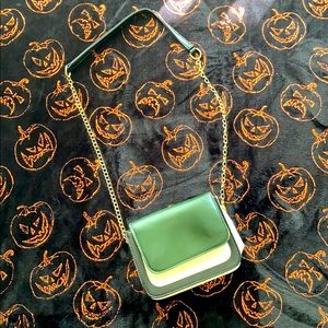 Green, white and black purse